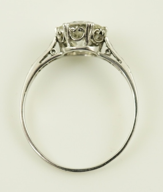 A platinum and single stone diamond set ring, with graduated eight stone diamond chip set shoulders, with a Mappin & Webb probate valuation dated 01/06/2024